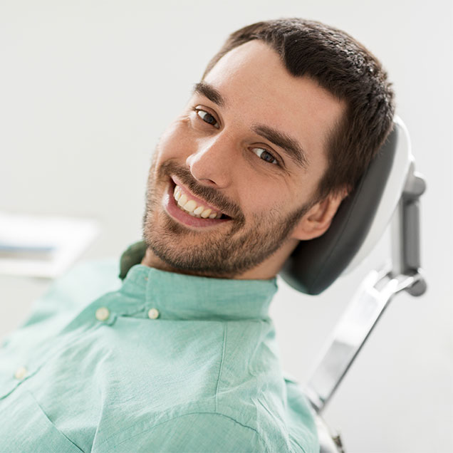 Happy male dental patient